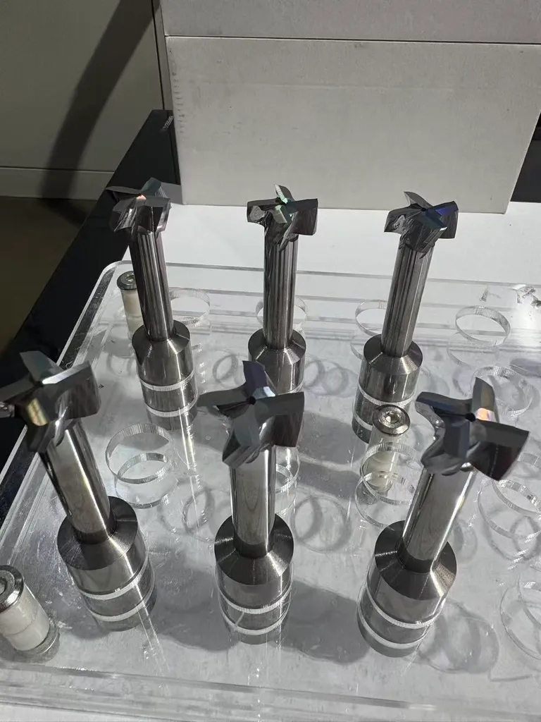 Solid carbide T-slot and keyseat end mills with coolant-through holes, workshop photo before coating